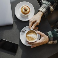 close_up_woman_enjoying_coffee_break.jpg