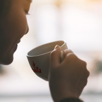 closeup_image_beautiful_woman_holding_drinking_hot_coffee_1.jpg