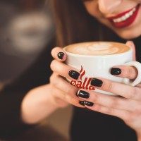 smiling_woman_good_mood_enjoy_cup_coffee_sitting_cafe_1_.jpg